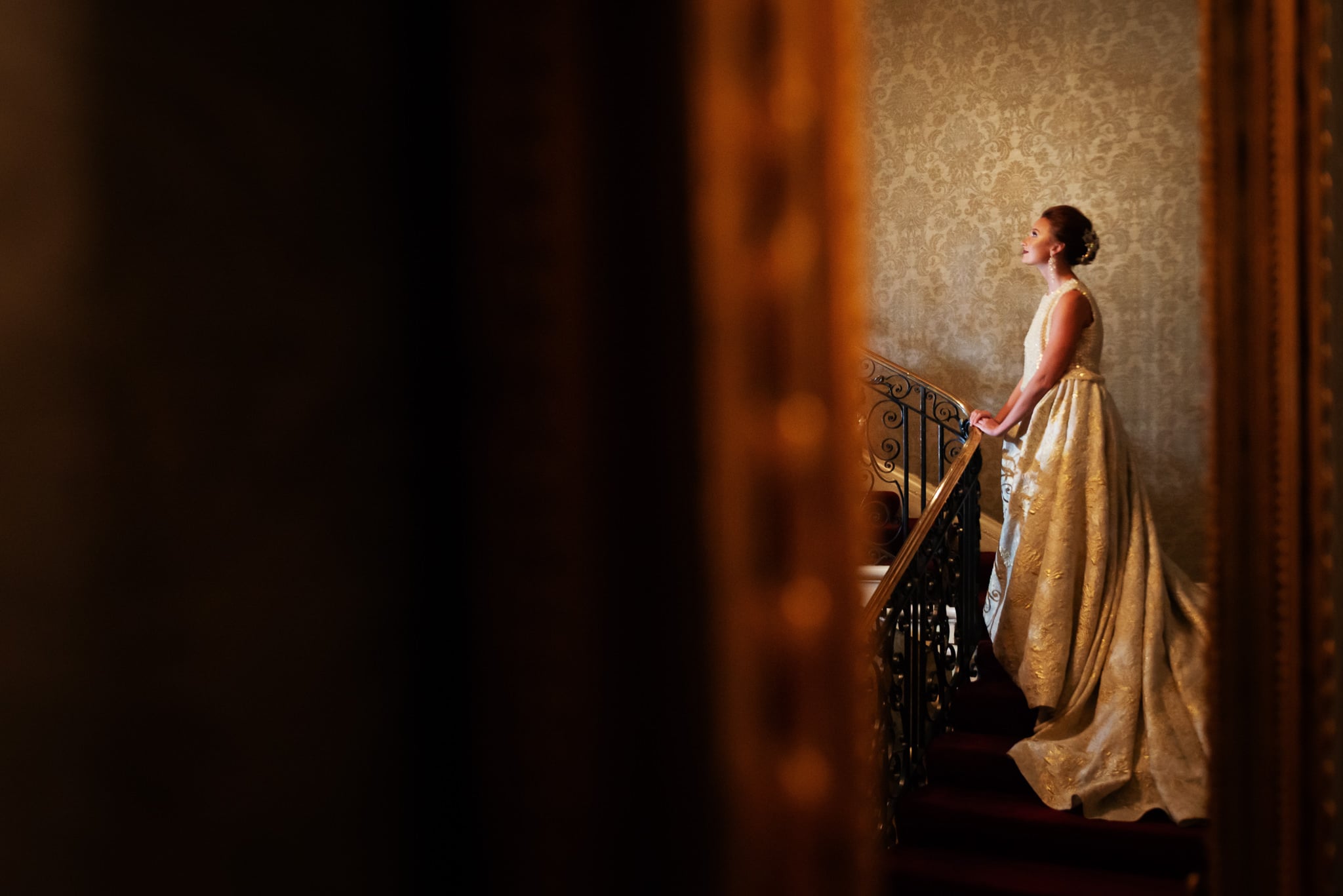 A portrait of the bride on the staircase at Hedsor House