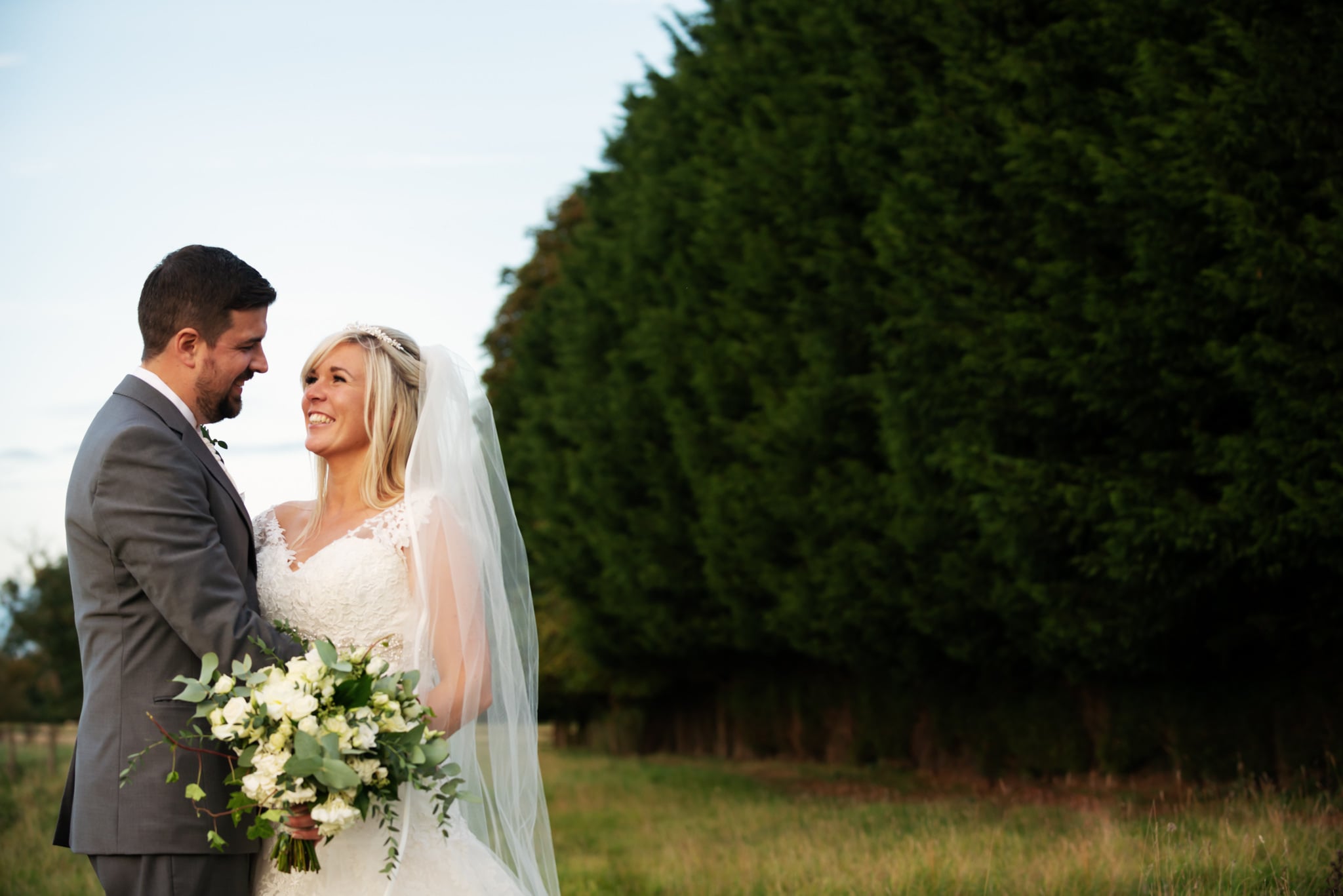Portrait of bride and groom during golden hour at Notley Tythe Barn wedding