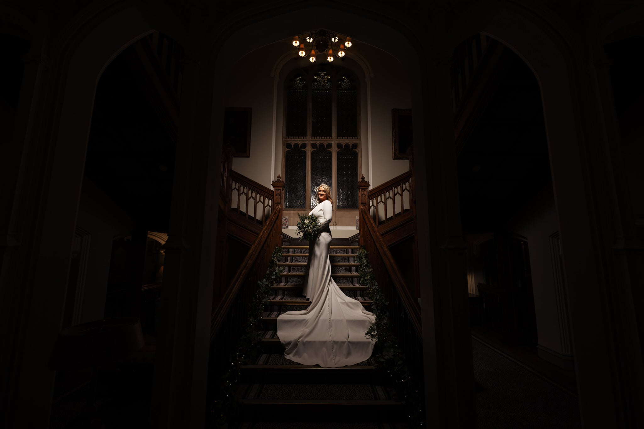 Couple portrait on the staircase at Latimer Estate