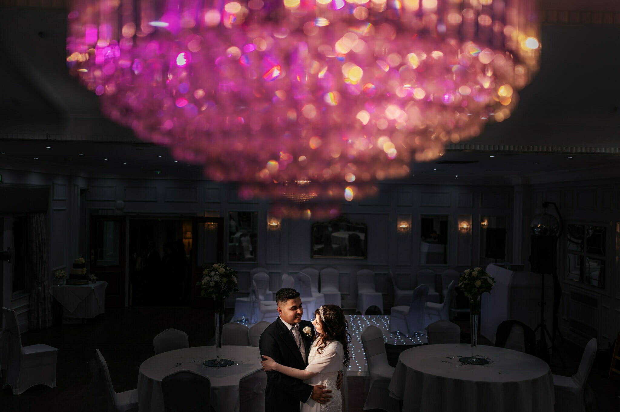 An indoor portrait of bride and groom at Burnham Beeches wedding