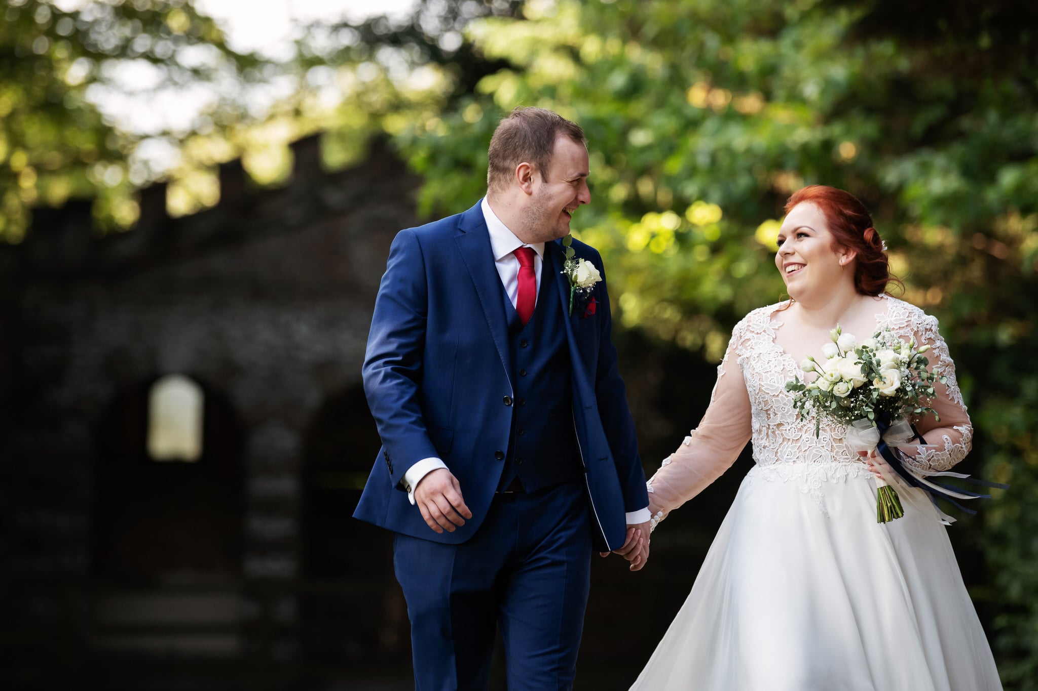 Bride and groom walking in the grounds of Missenden Abbey