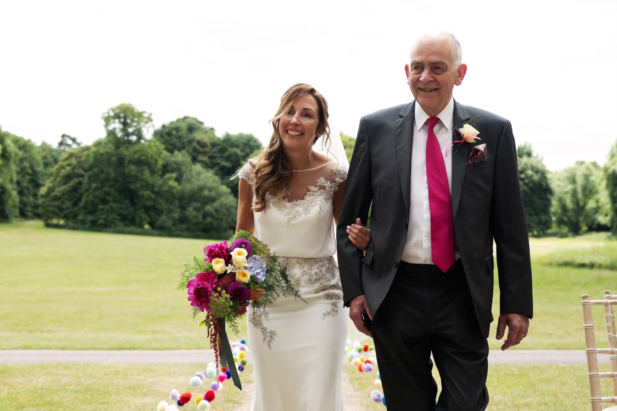 The Bride walking arm in arm with her father at the beginning of the wedding ceremony.