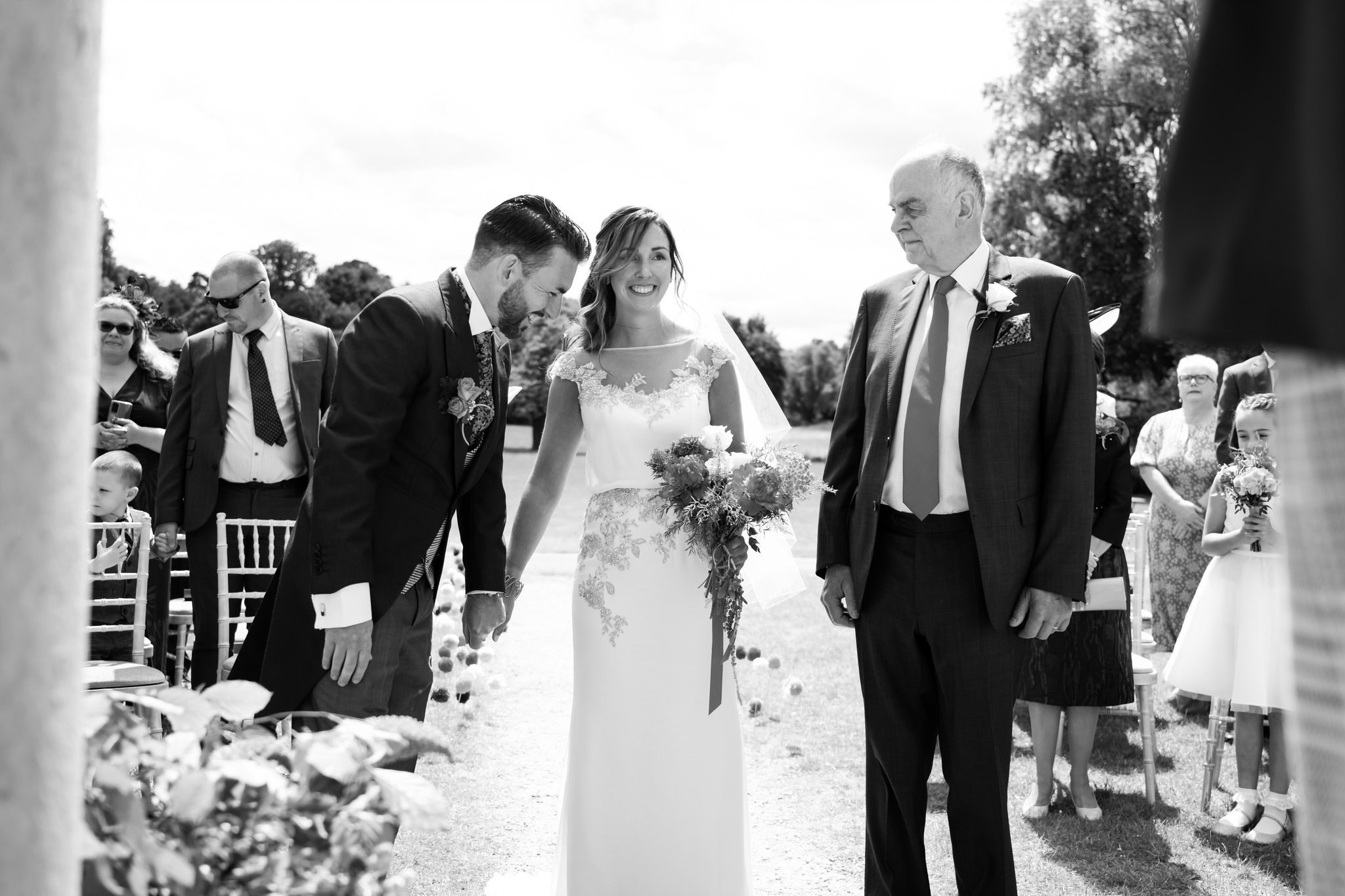 The groom reacts to seeing the Bride at the beginning of the wedding ceremony.