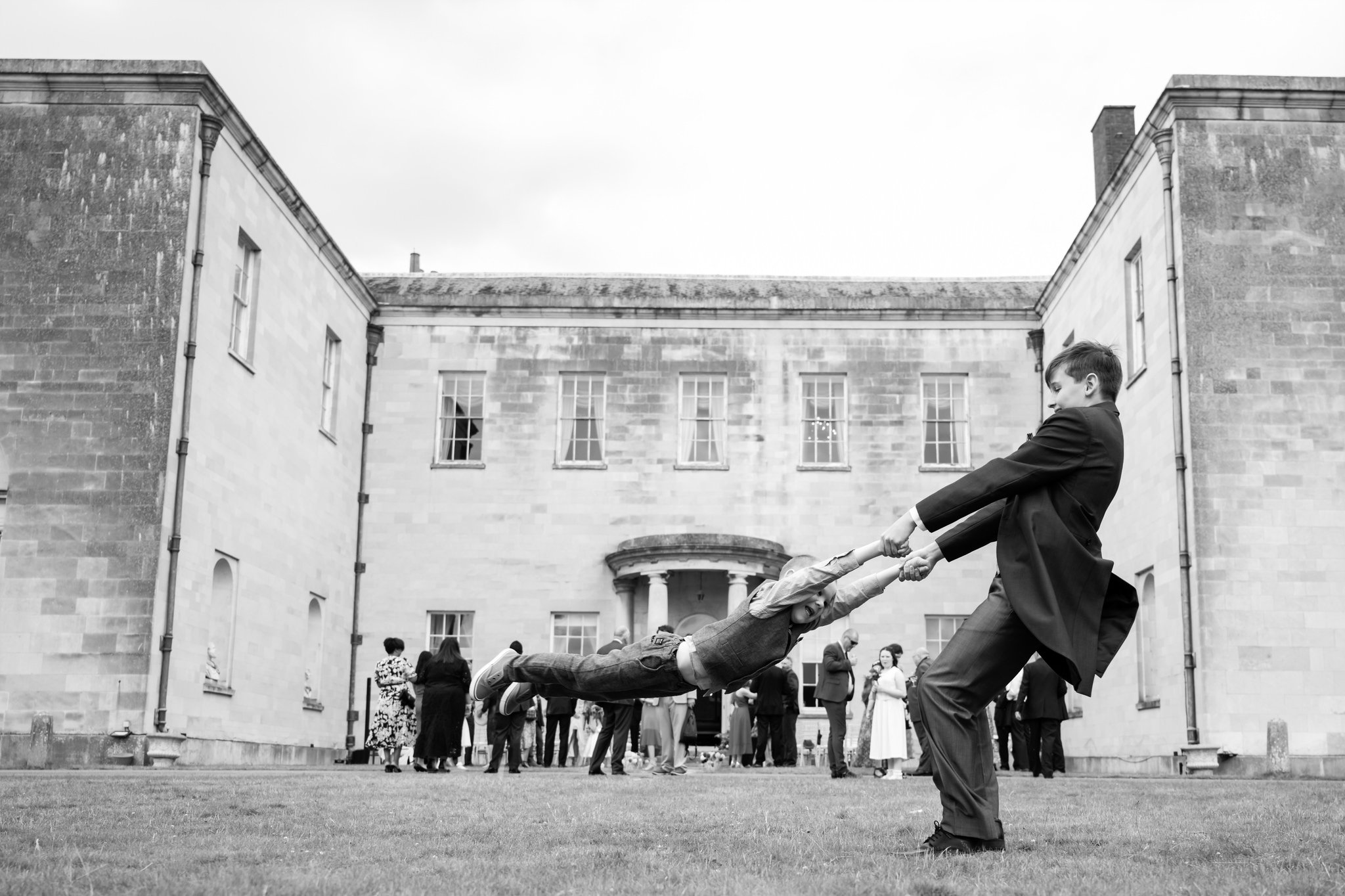 Kids playing during the wedding reception at Hitchin Priory.