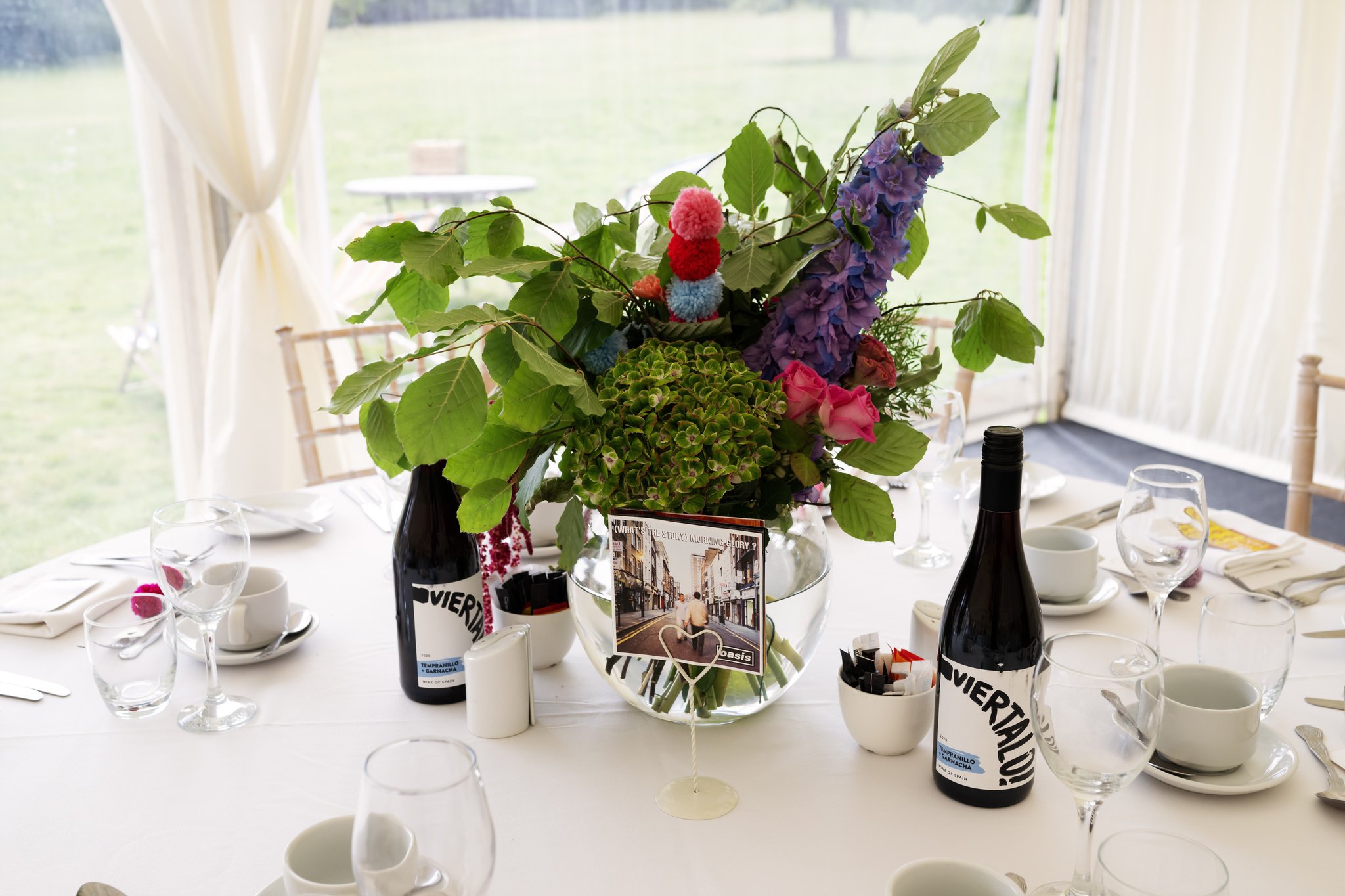 A colourful table centrepiece at a Hitchin Priory wedding.