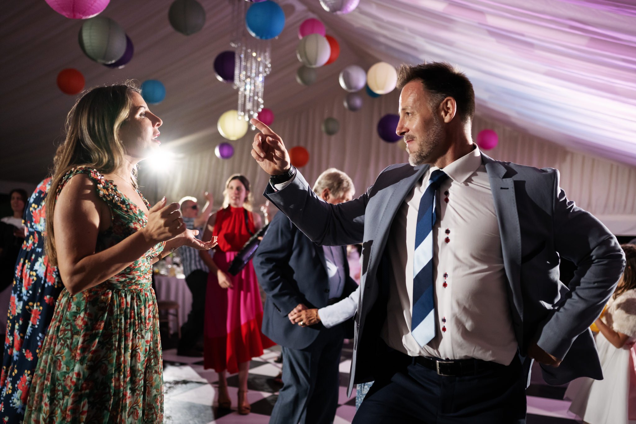 Wedding guests dancing at a Hitchin Priory wedding.
