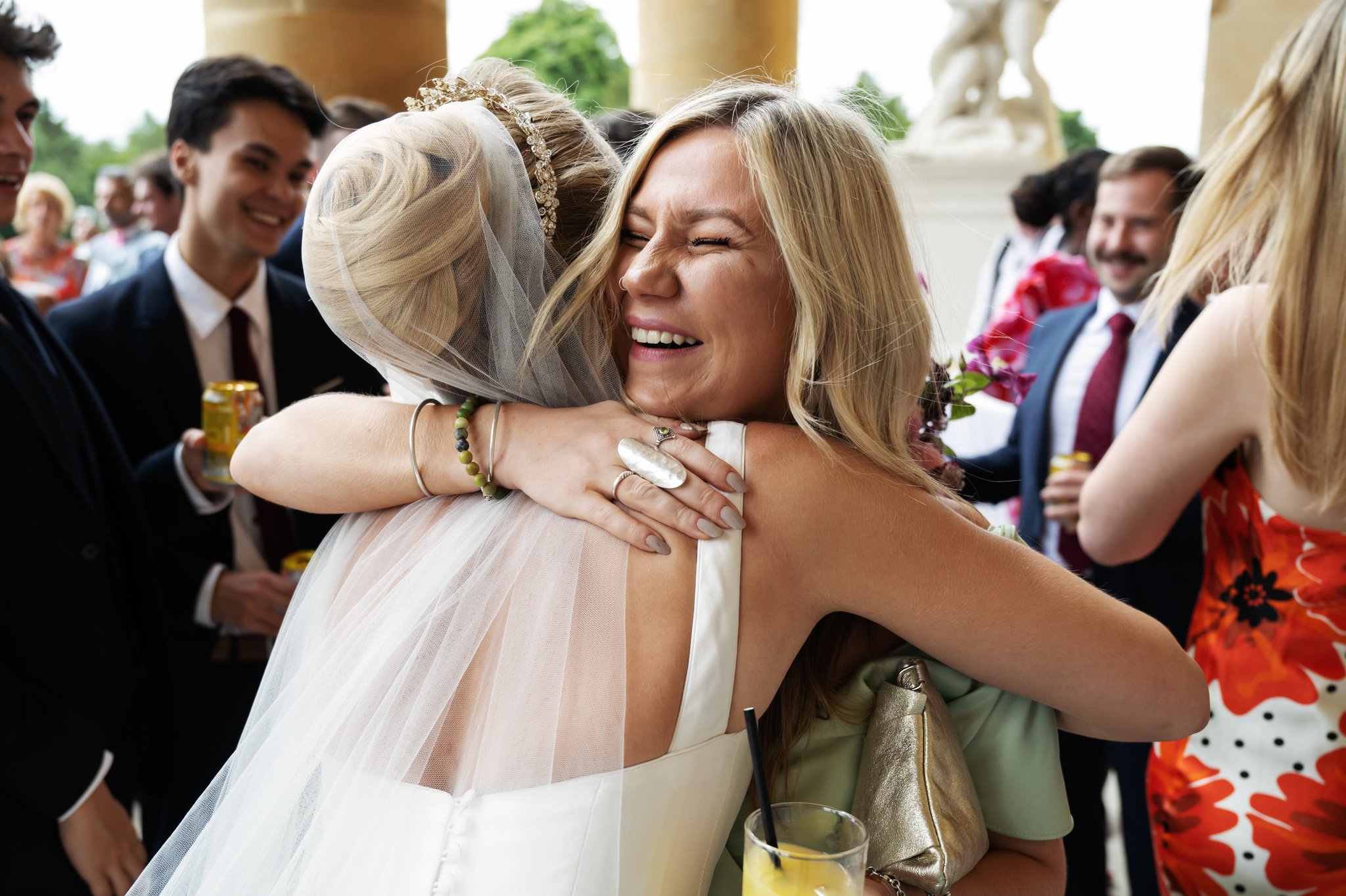 A wedding guest gives the bride a big hug at a Stowe House wedding.