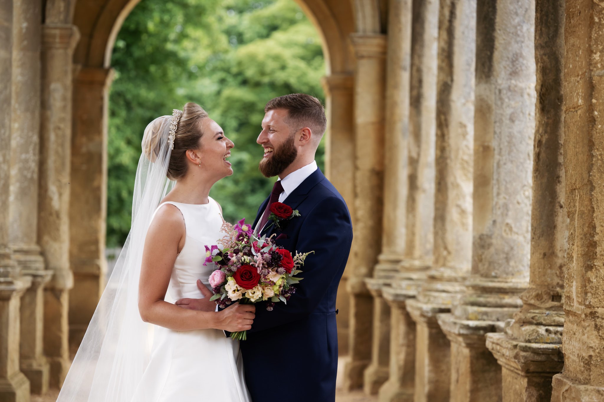 A portrait of the bride and groom on The Palladian Bridge at Stowe House.