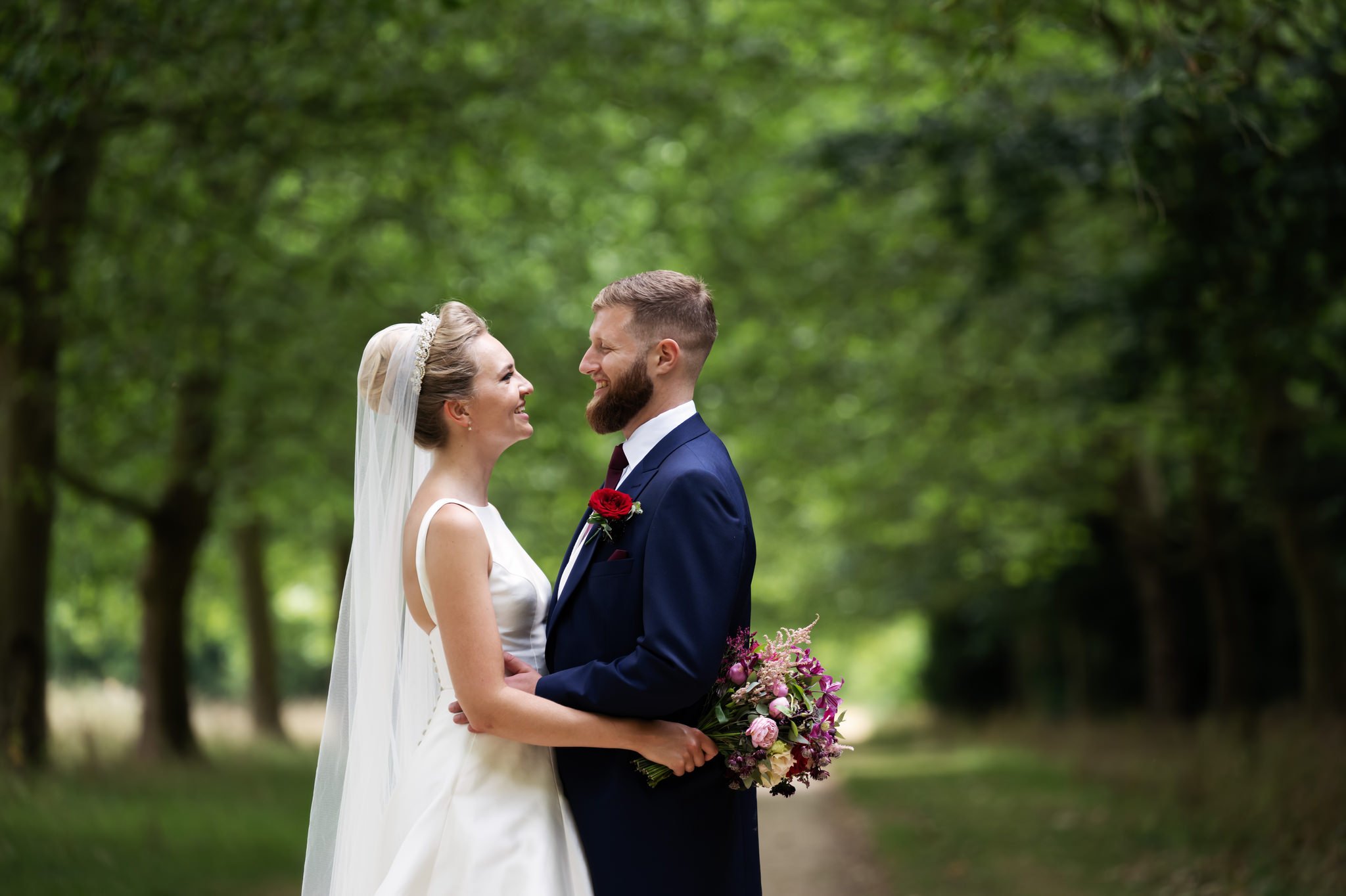 A portrait of the bride and groom on Pegg's Terrace at Stowe.