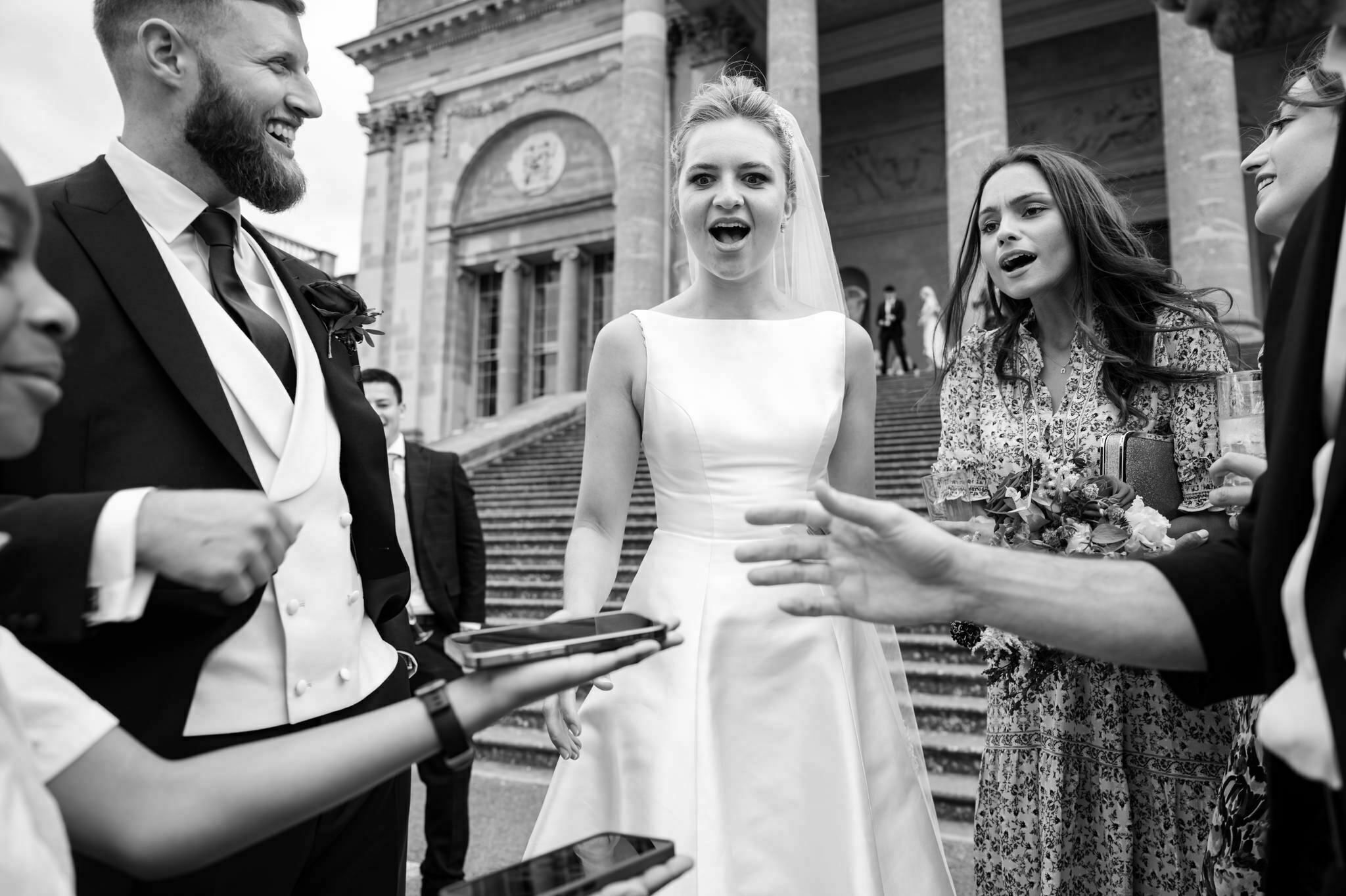 The bride and groom are surprised at the end of a magic trick performed by magician Gary Schiffman.