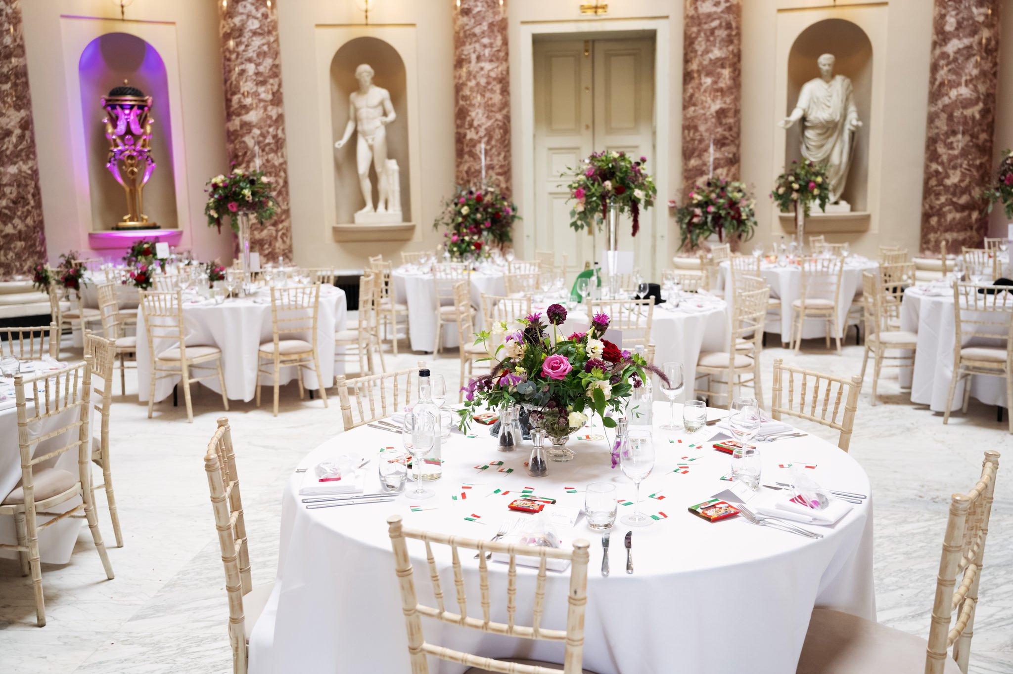 Tables setup for wedding breakfast at The Marble Hall.