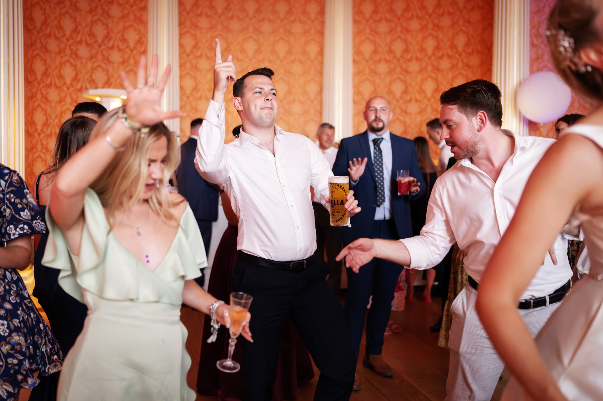 Wedding guests dancing on the dance floor at a Stowe House wedding. Stowe House wedding photographer.