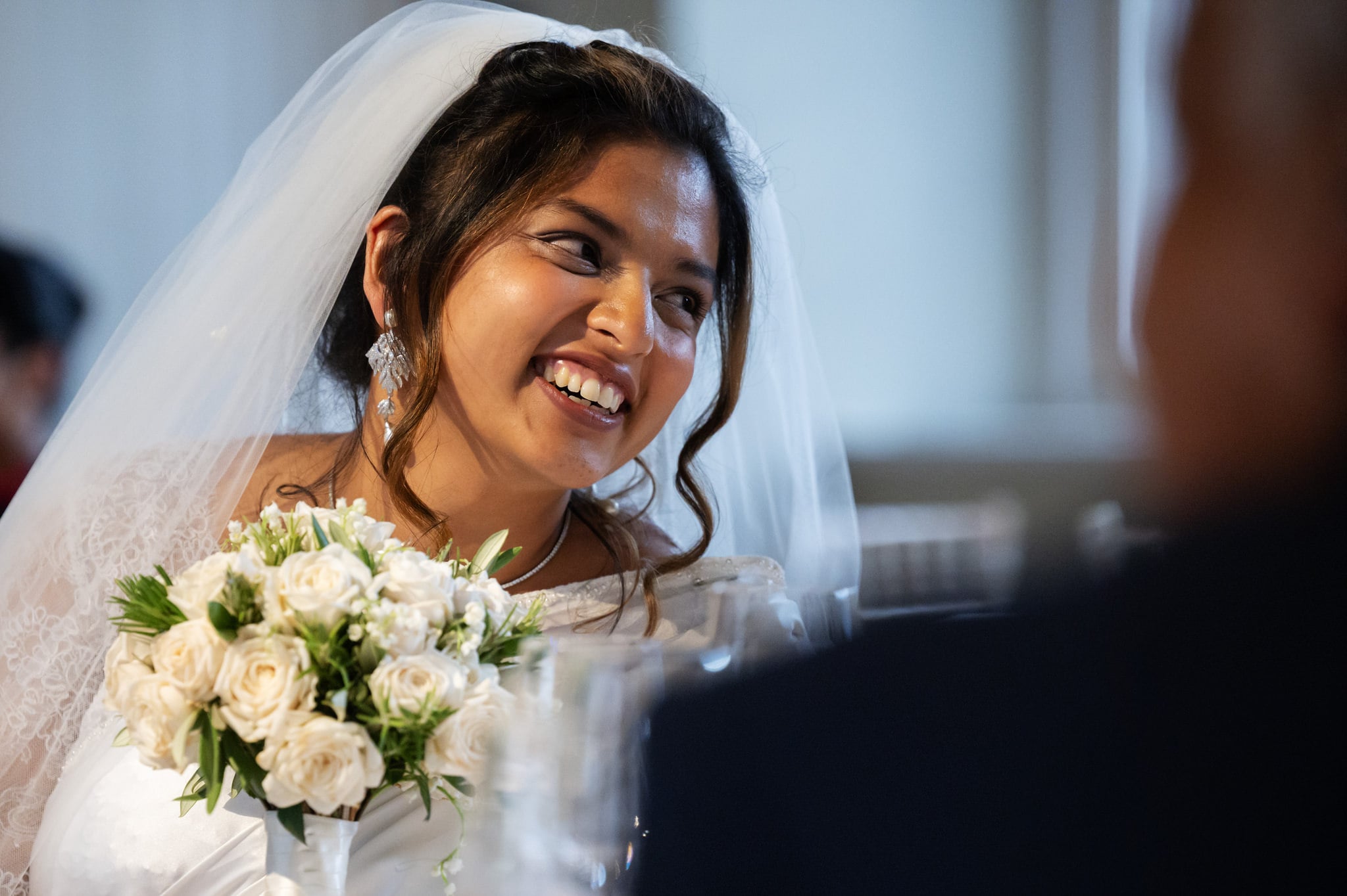 The Bride listening to speeches.