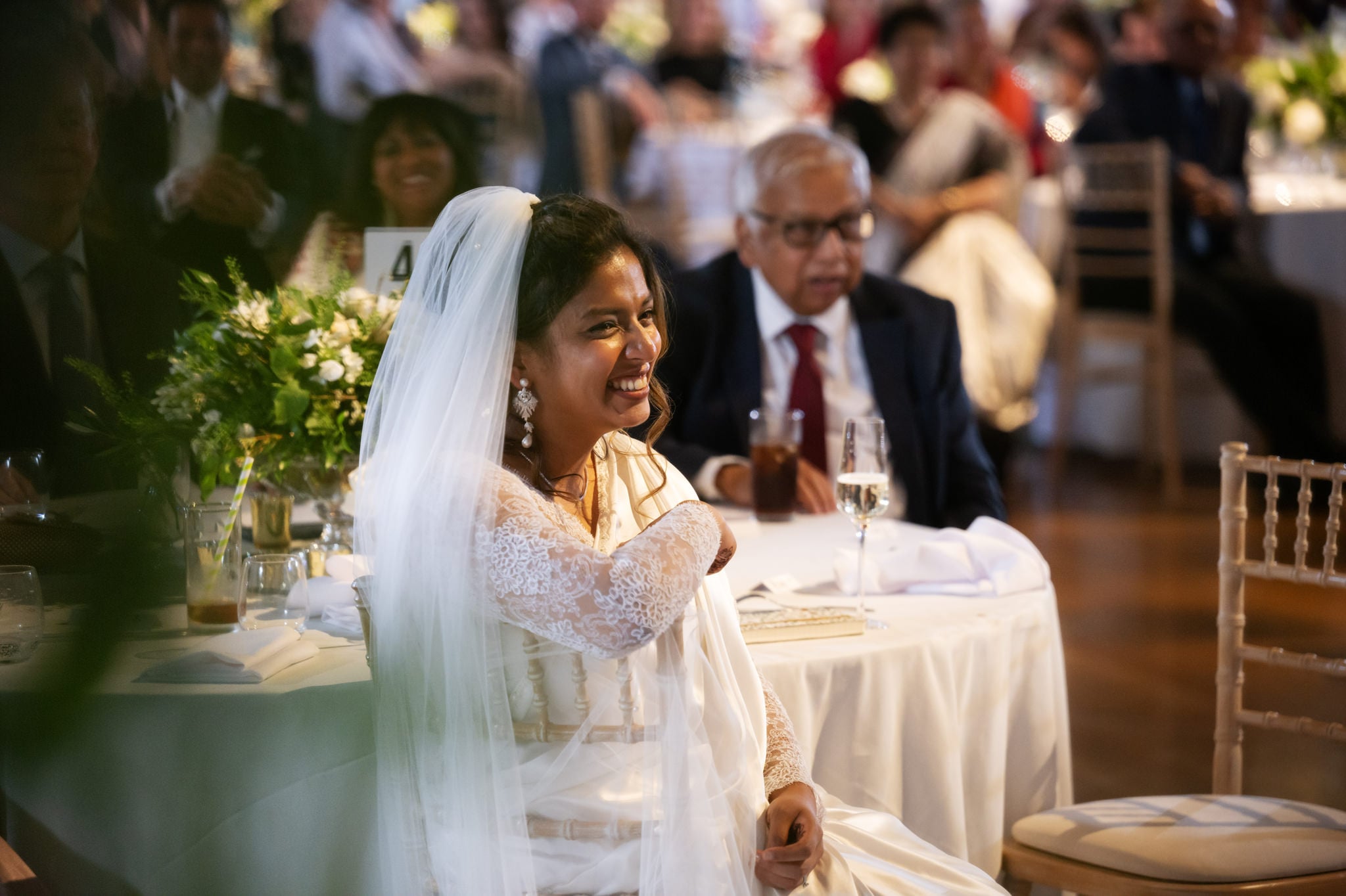 My bride sat down listening to the speeches at a Banqueting house wedding