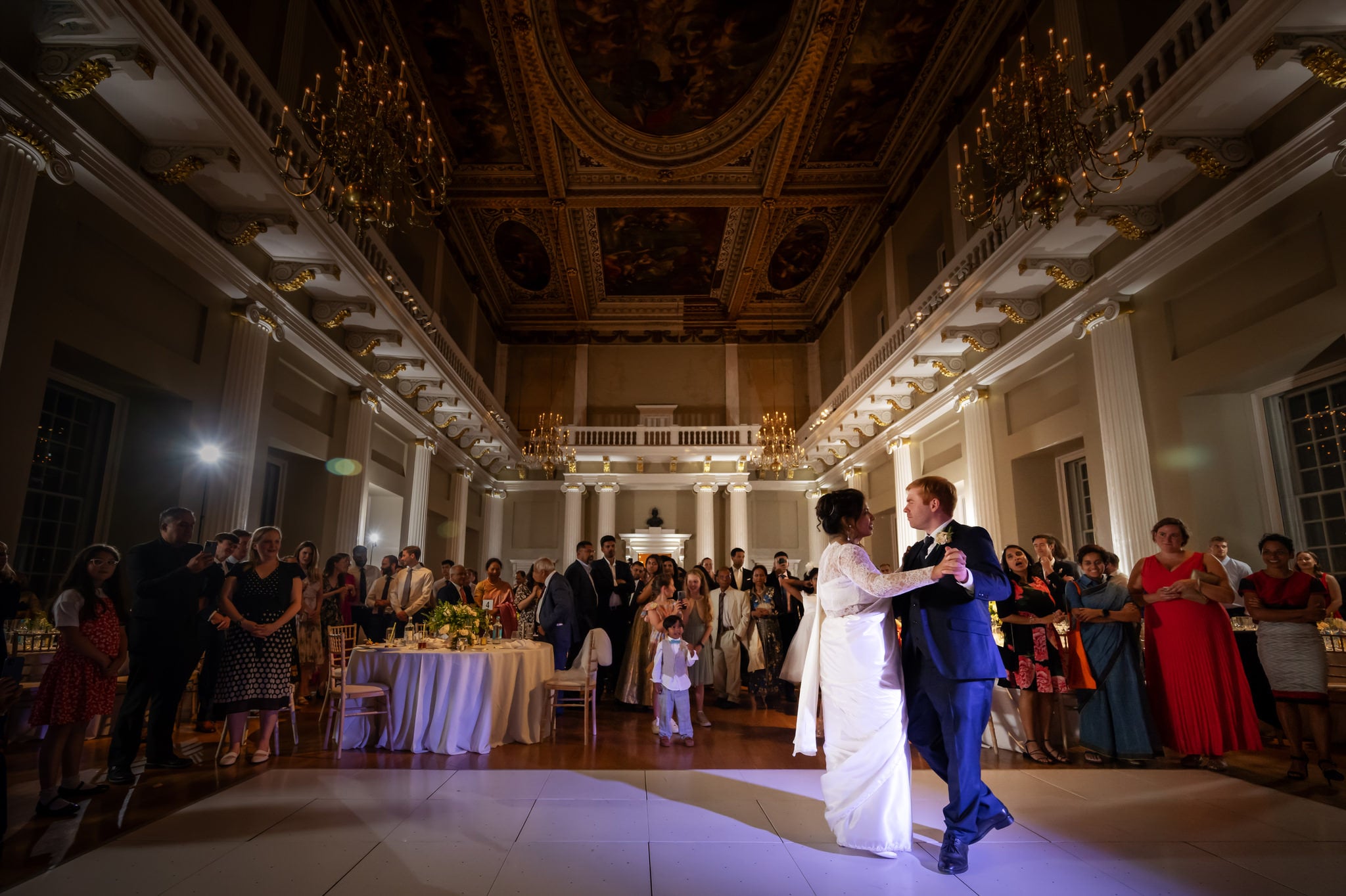 A wide shots of the bride and groom during their first dance at a banqueting house wedding in London.