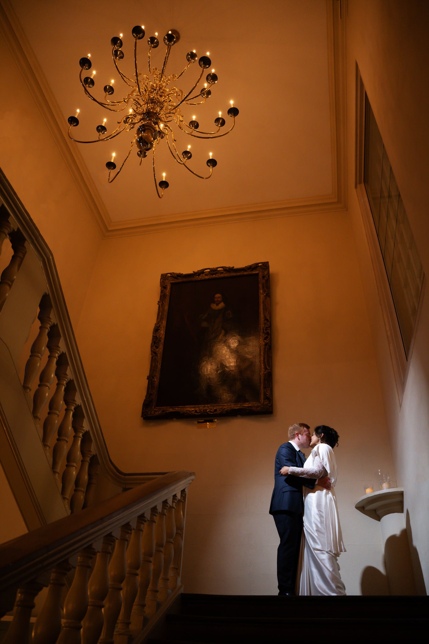 A portraits of the bride and groom on the stairs at Banqueting House.