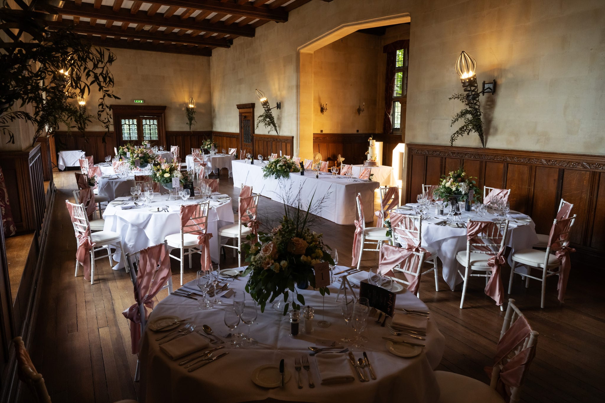 The great hall at Fanhams Hall decorated for wedding breakfast.