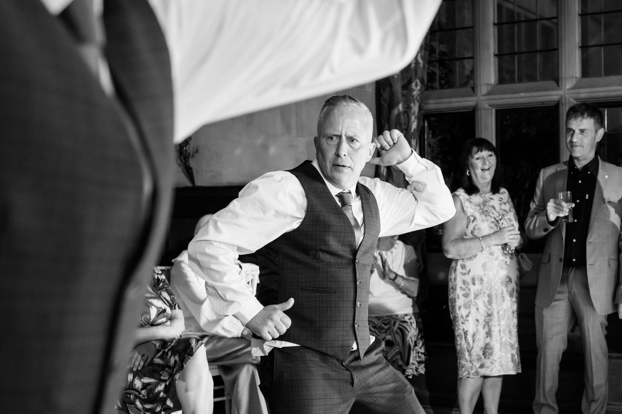 The groom dancing on the dance floor at the end of the wedding day at Fanhams Hall.
