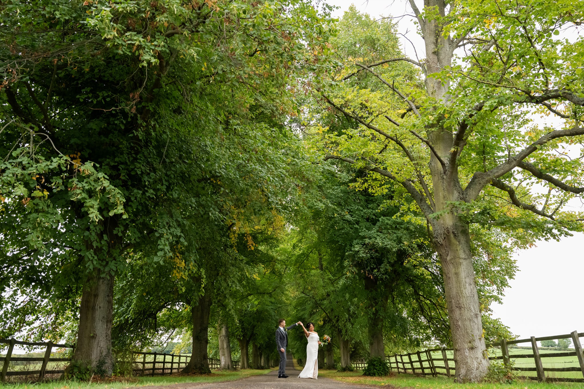 A portrait of the bride and groom on the driveway at Notley Abbey. Notley Abbey wedding photographer.