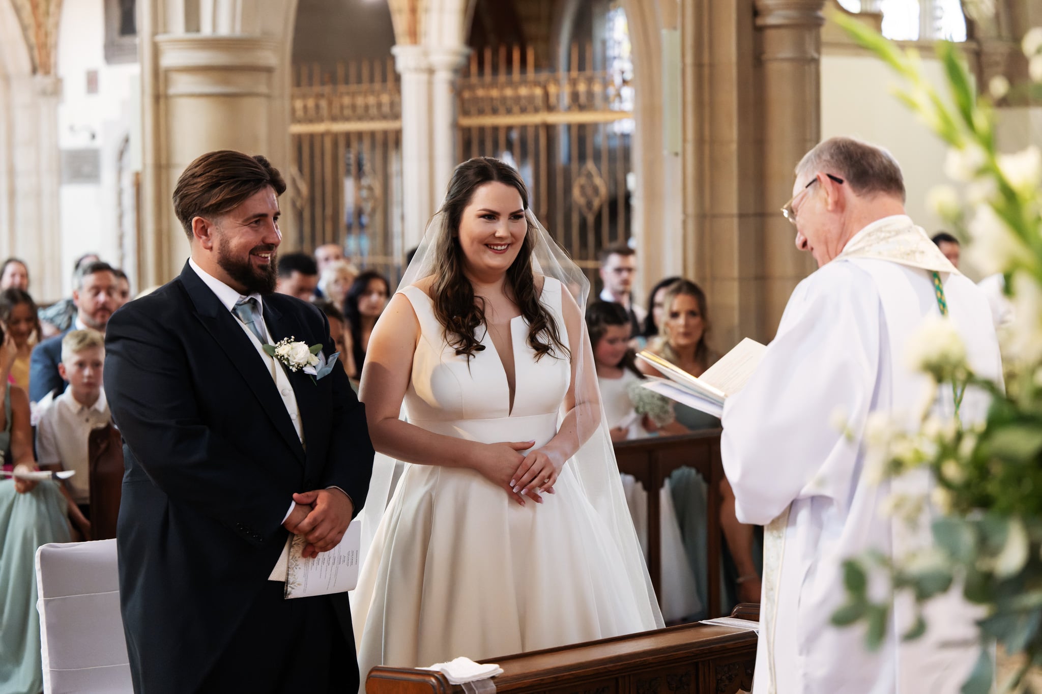 The bride and groom during a wedding ceremony in a Watford church