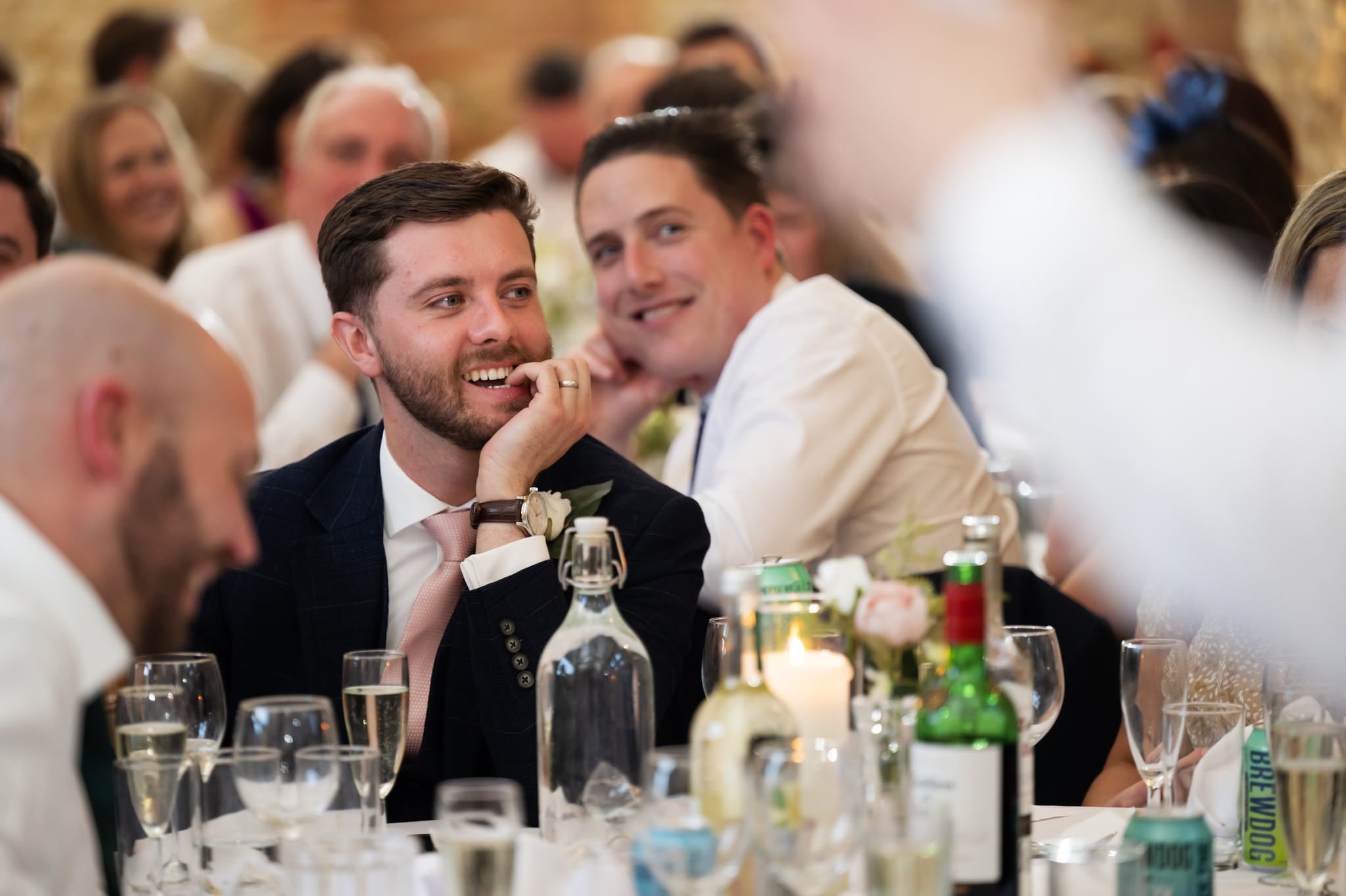 A Huntsmill Farm Wedding Photographer captures a man's laughter at a reception.