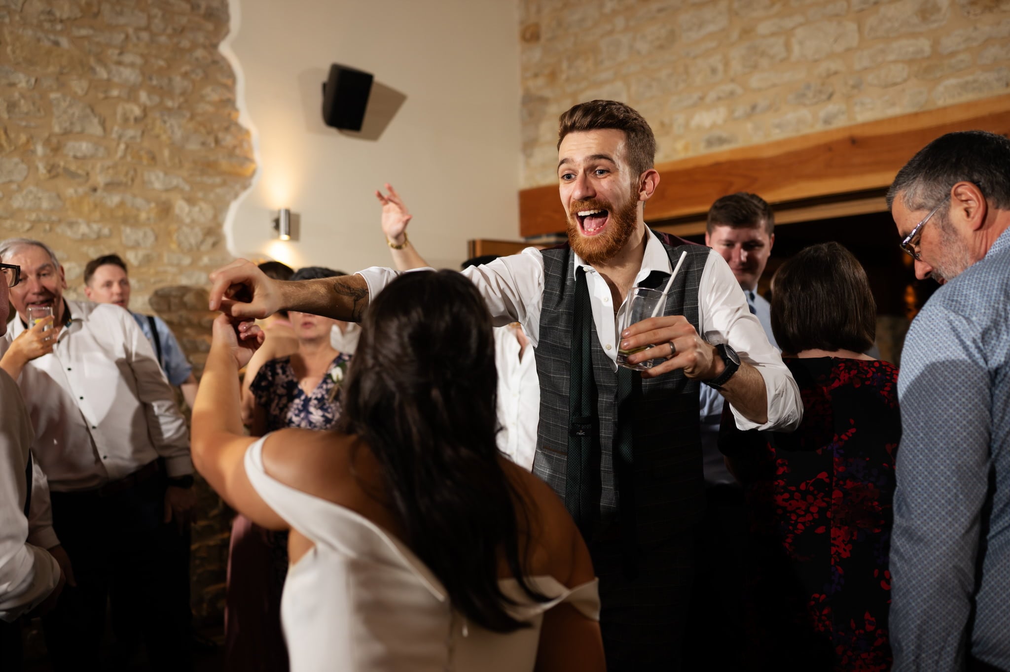 A bride and groom gracefully dancing at a wedding reception, captured by Huntsmill Farm Wedding Photographer.