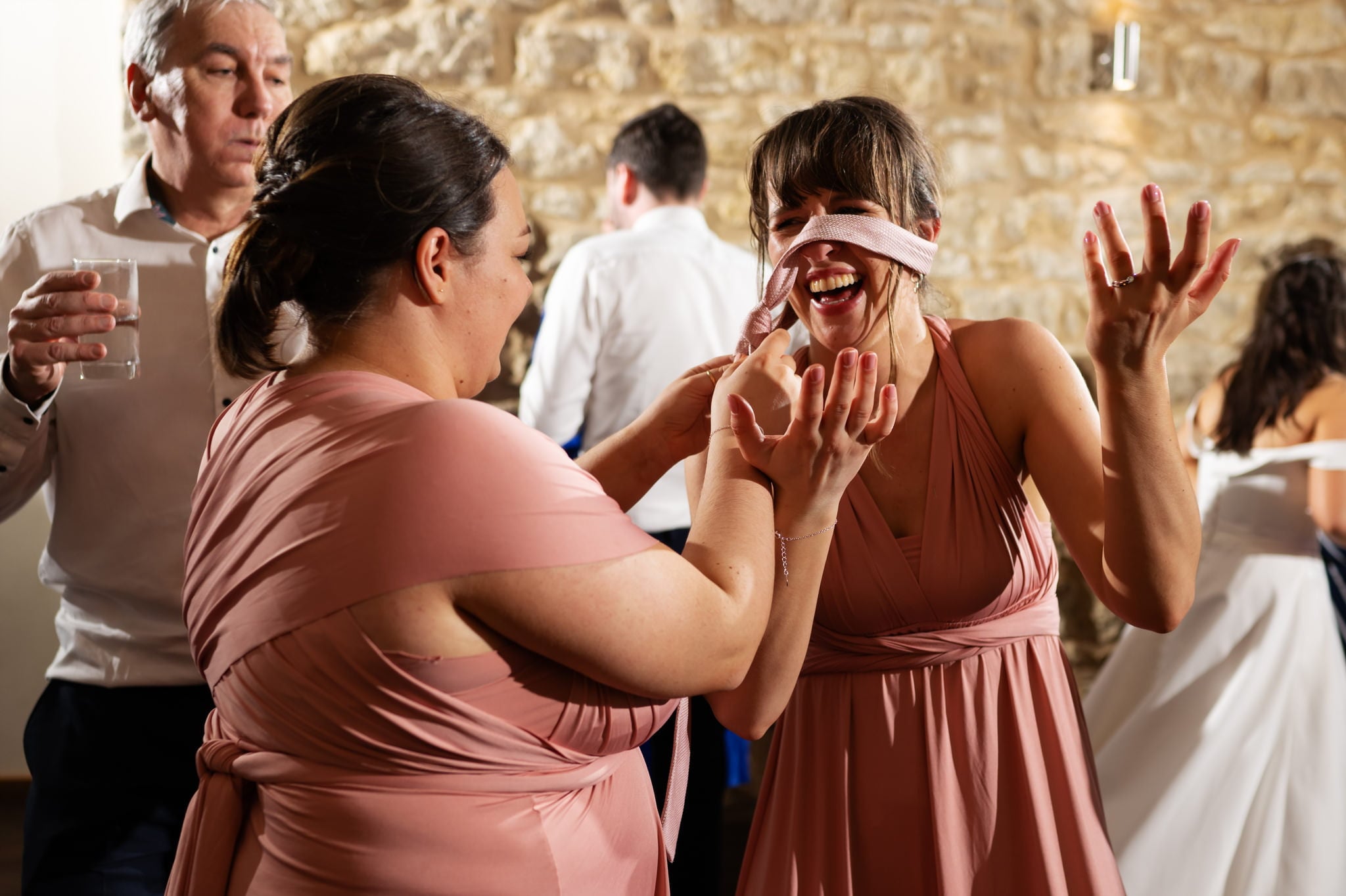 A group of bridesmaids captured in joyful moments by a Huntsmill Farm Wedding Photographer.