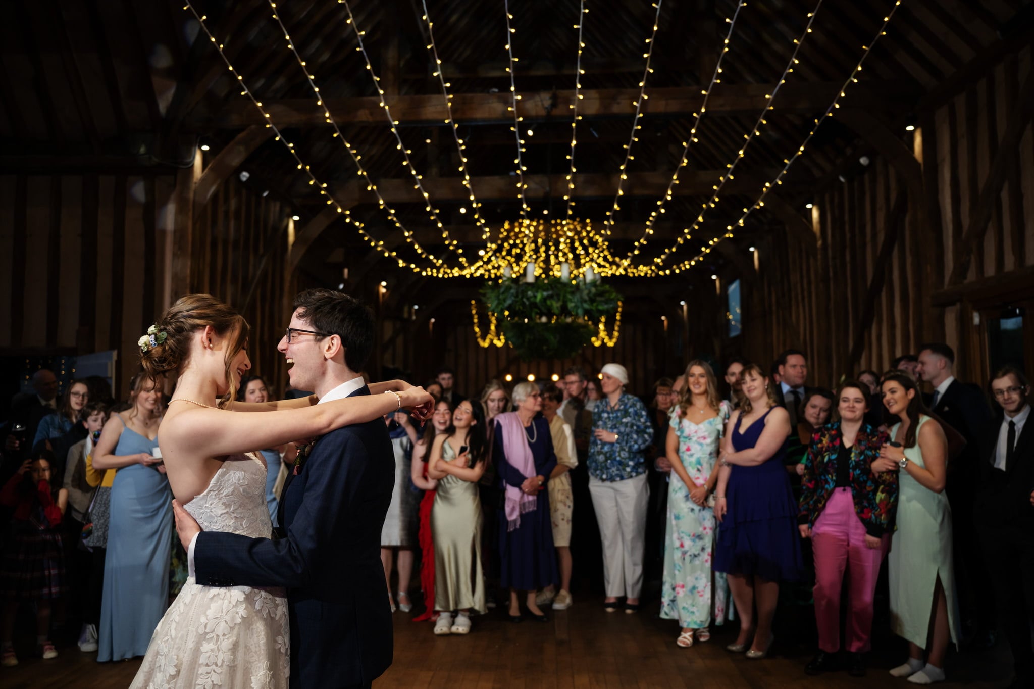 A couple's splendid first dance captured by the Lillibrooke Manor Wedding Photographer in a charming barn.