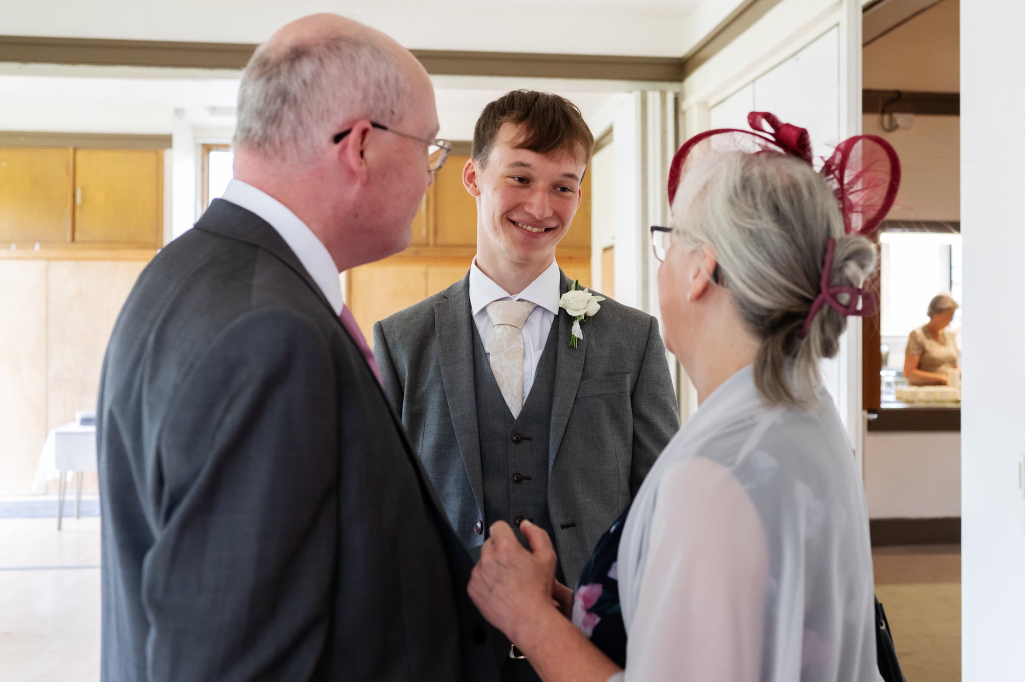 The groom talking to his parents