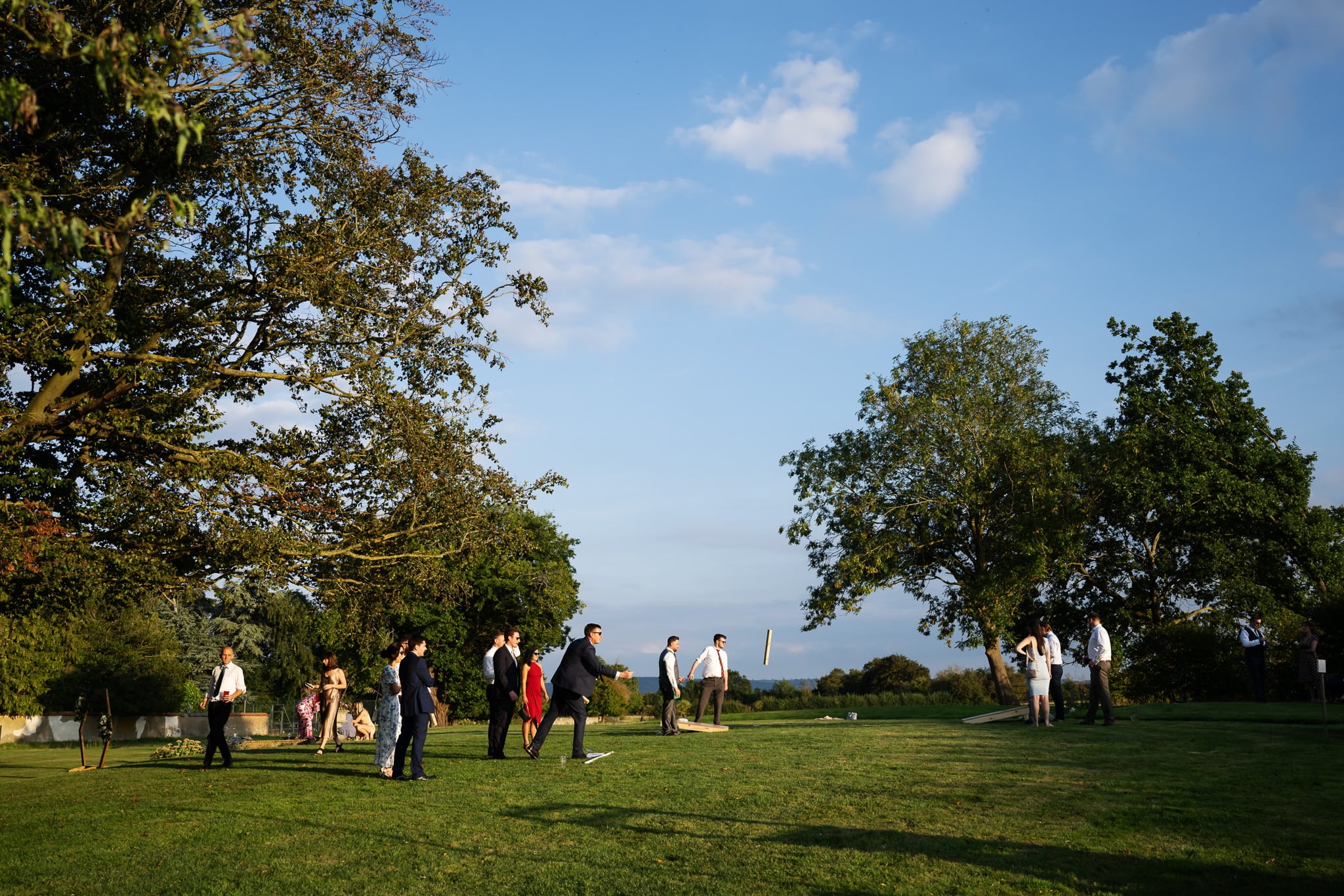 A group of people playing frisbee in a field.