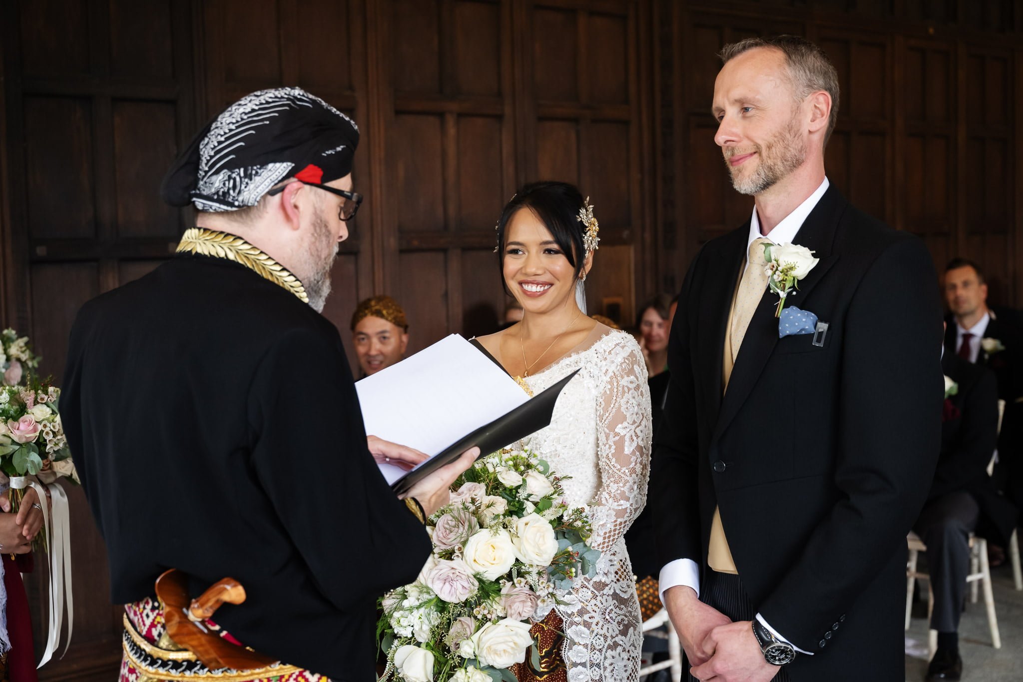 A bride and groom exchange vows at a wedding ceremony.