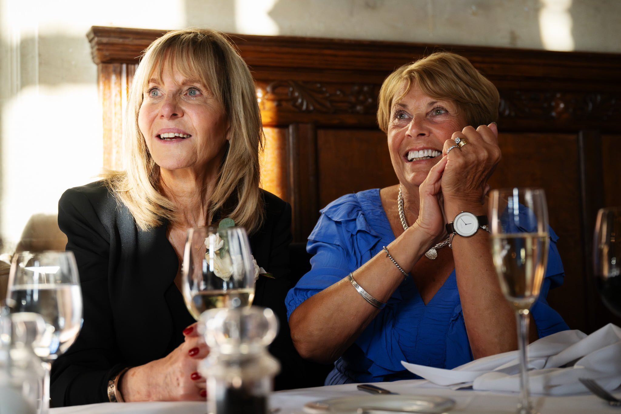 Two women sitting at a table.