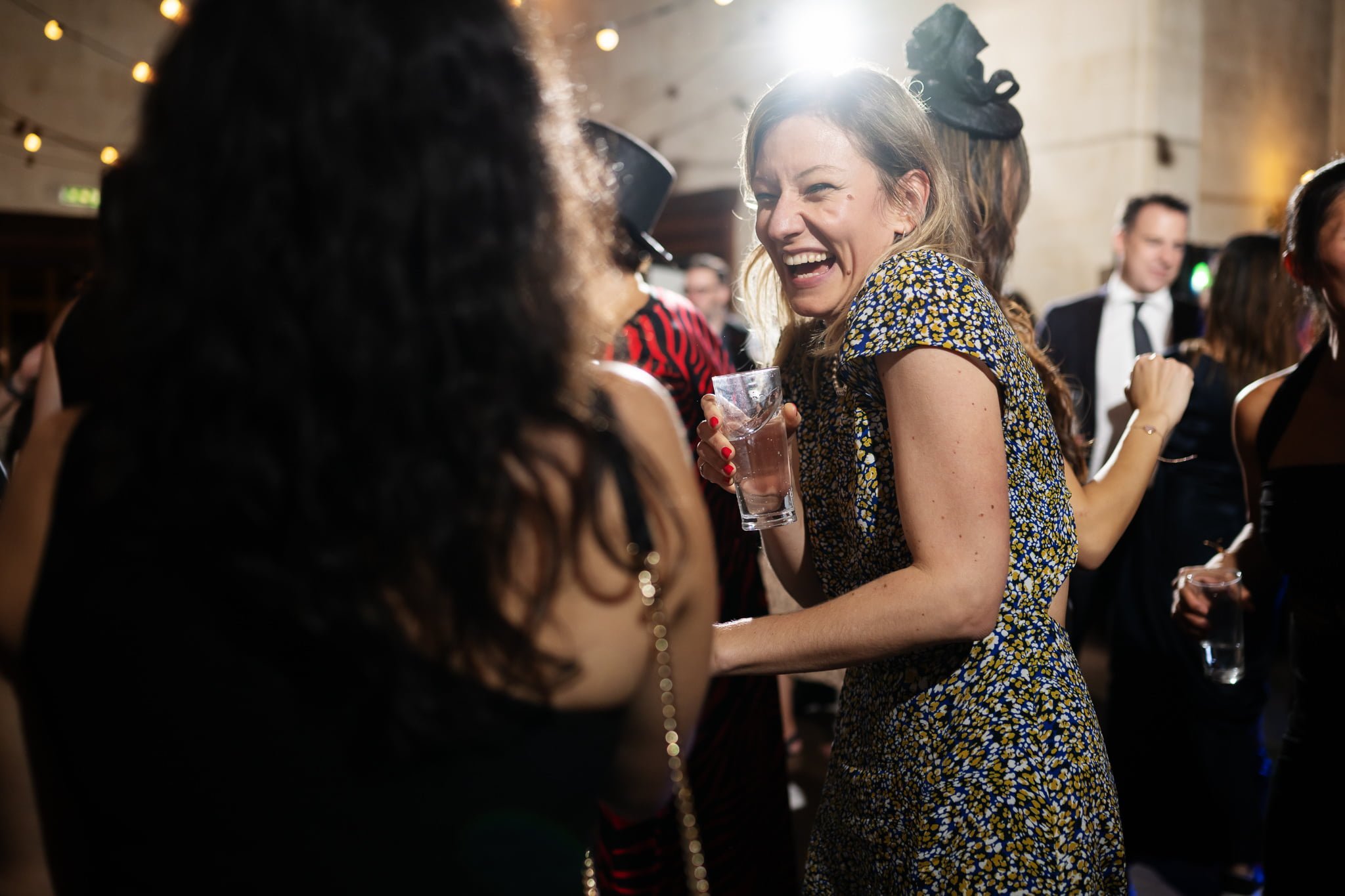 A group of people laughing at a party.