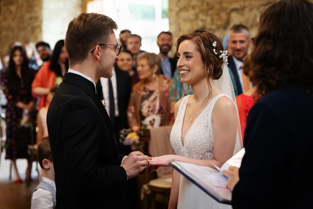 Bride and groom during their wedding ceremony in the Monk's Refectory at Notley Abbey