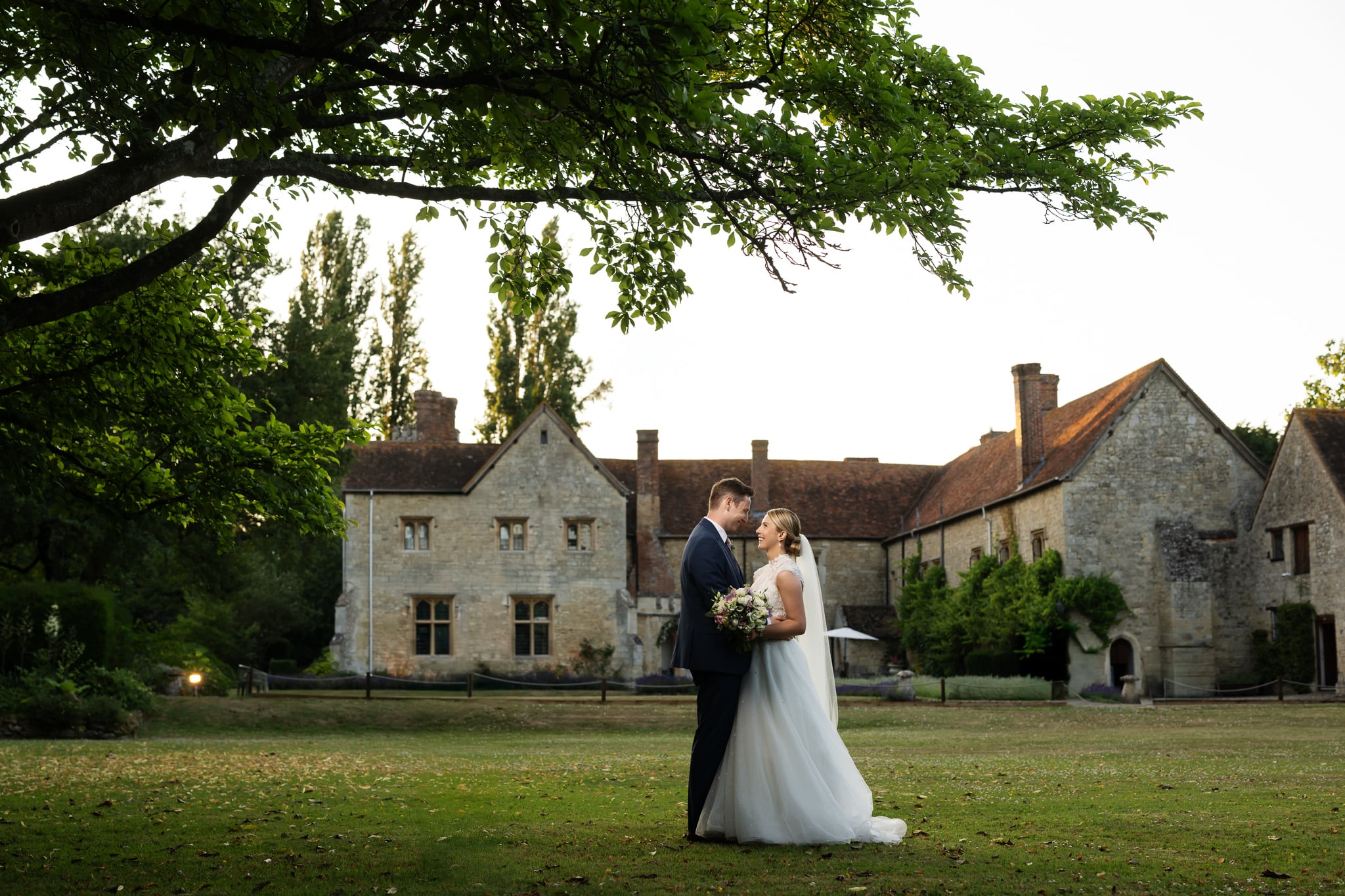 Bride and groom portrait with Notley Abbey in the background